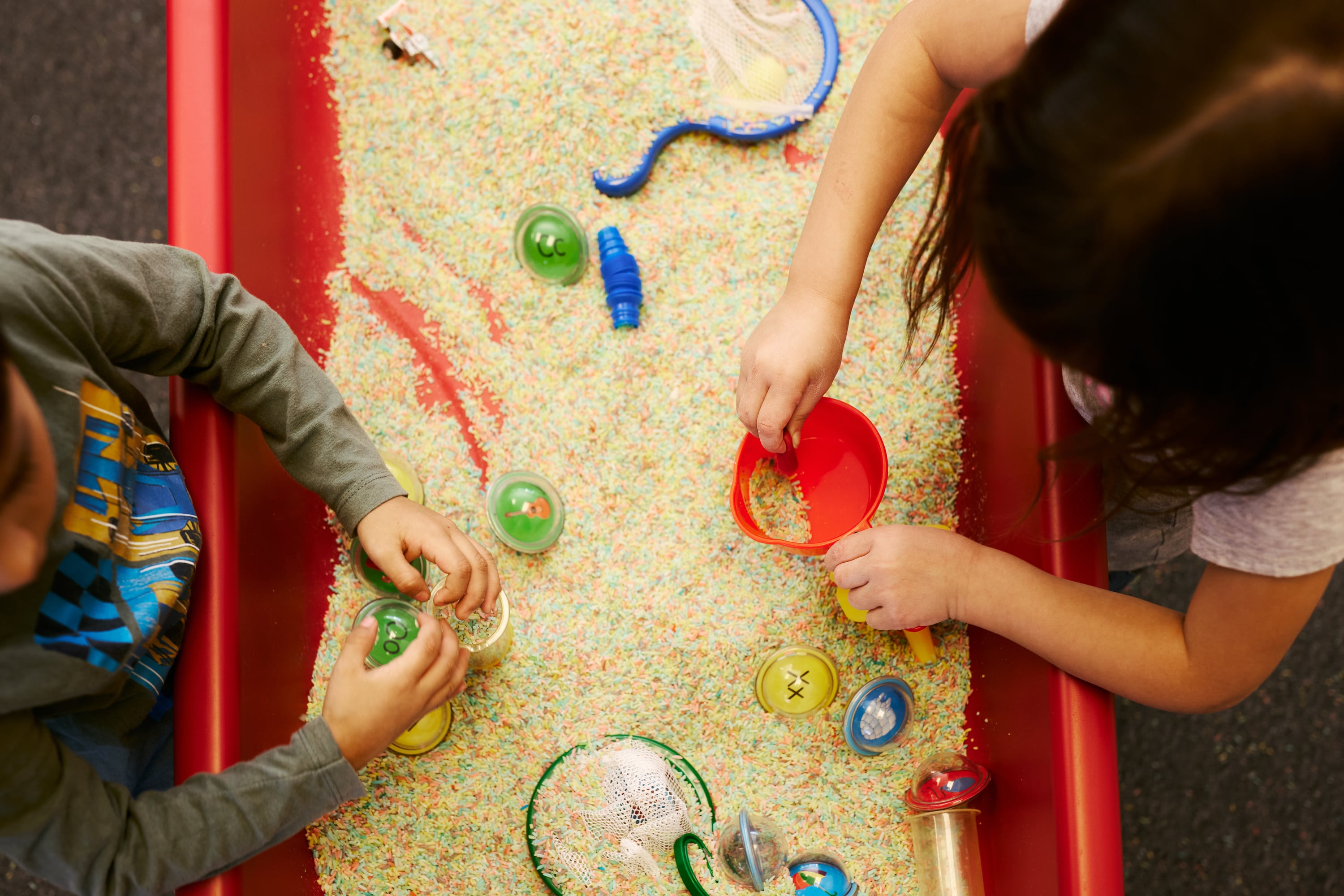 Bird's eye view of two preschool students playing.