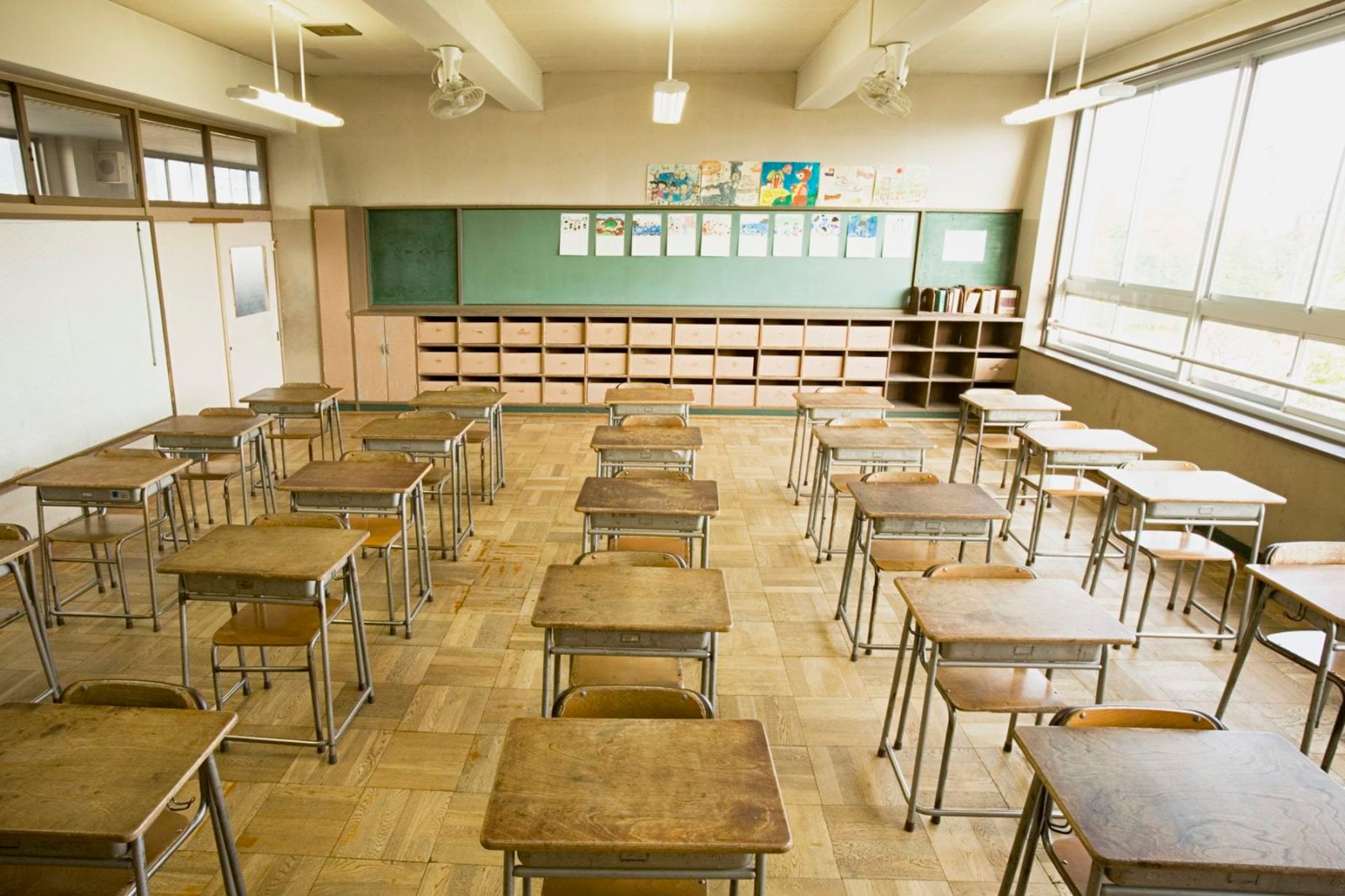 An empty classroom with desks and chairs