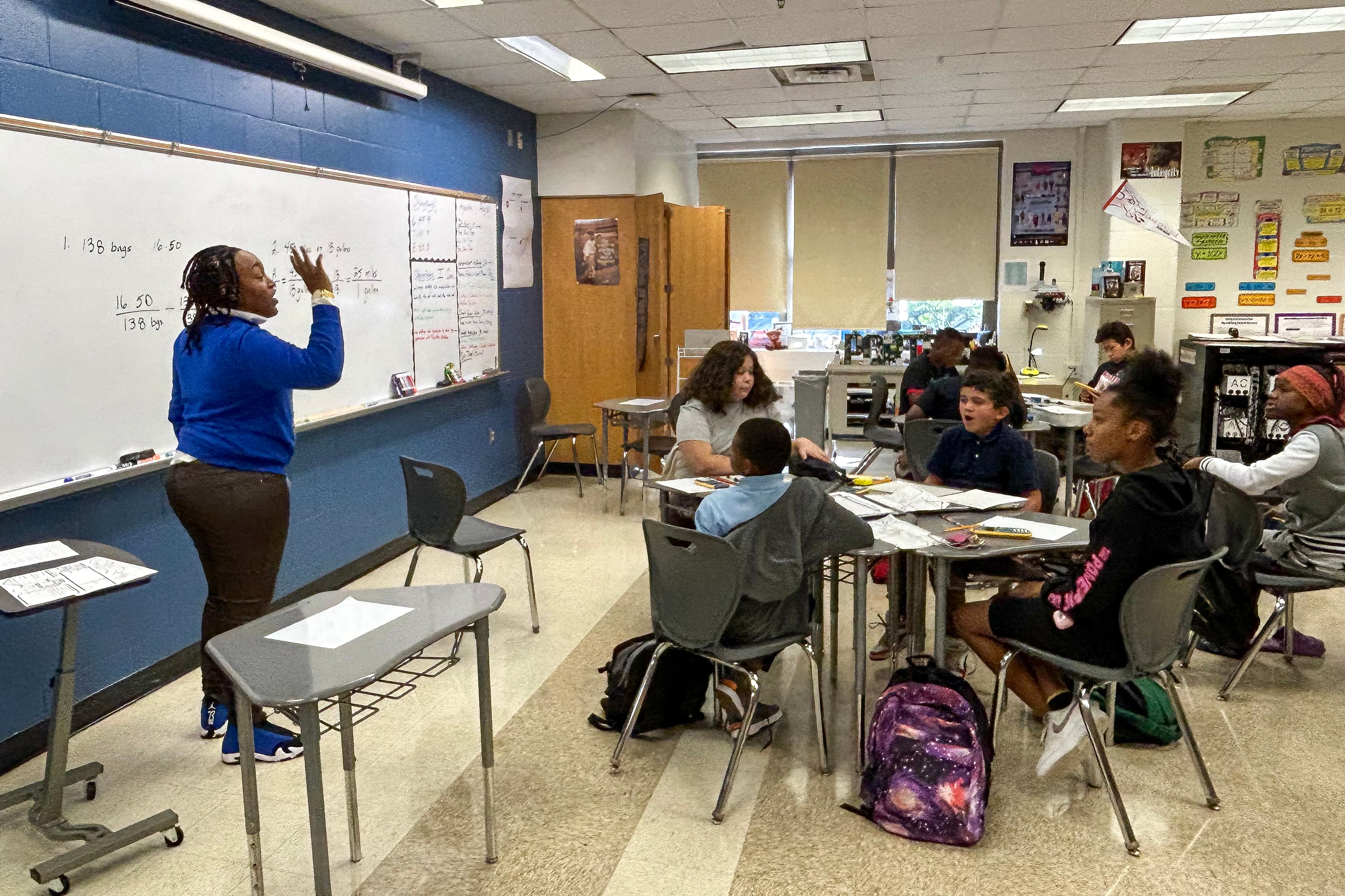 Teachers and students in a classroom.